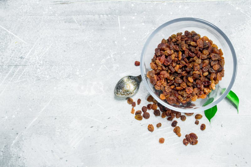 Raisins in a glass bowl royalty free stock photo