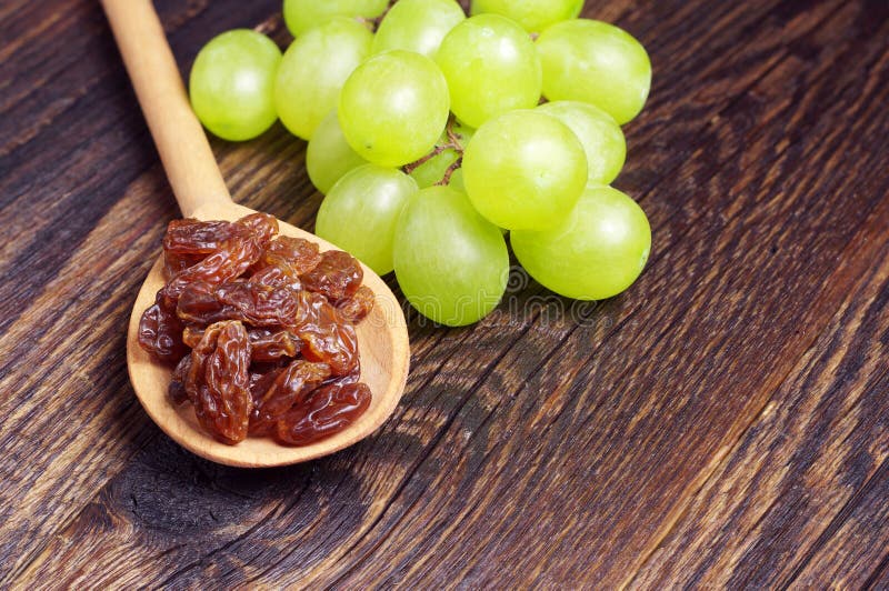 Raisins and grape leaves stock image. Image of natural 31535625