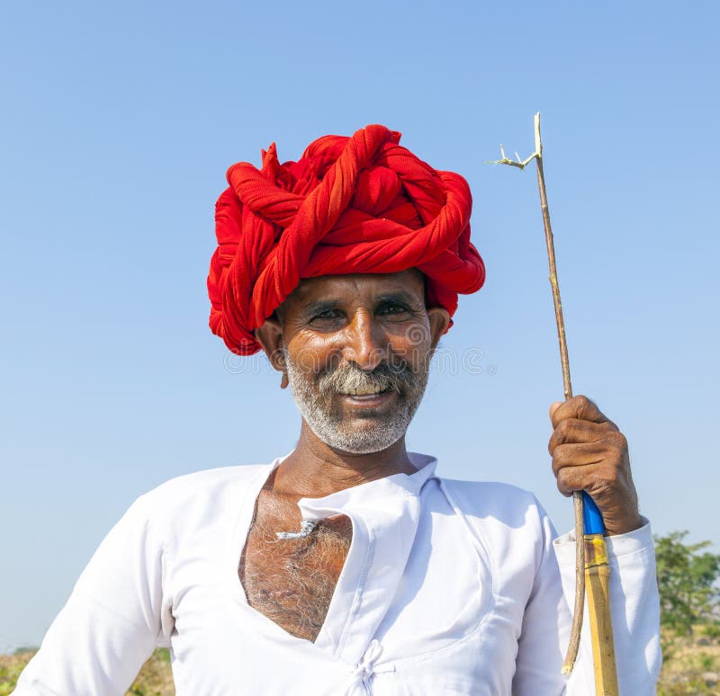 A Rajasthani tribal man wearing traditional colorful turban stock photos A Rajasthani tribal man wearing traditional colorful turban stock photos
