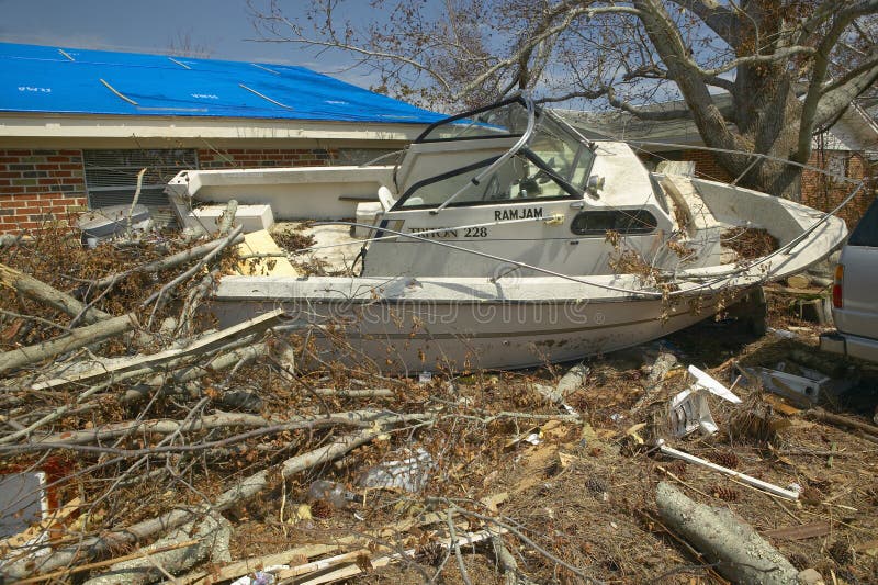 Ram Jam boat and debris in front of house heavily hit by Hurricane Ivan in Pensacola Florida