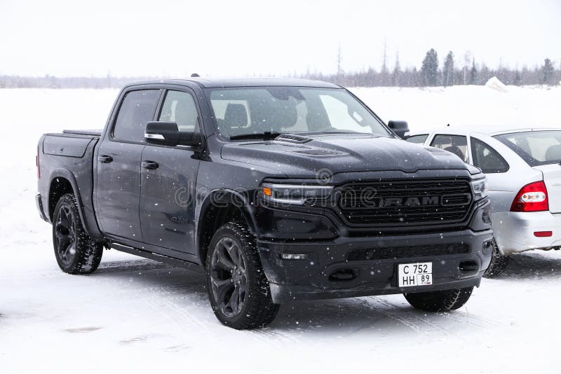 Tarko-Sale, Russia - March 2, 2024: Black pickup truck Ram 1500 in a snow covered tundra