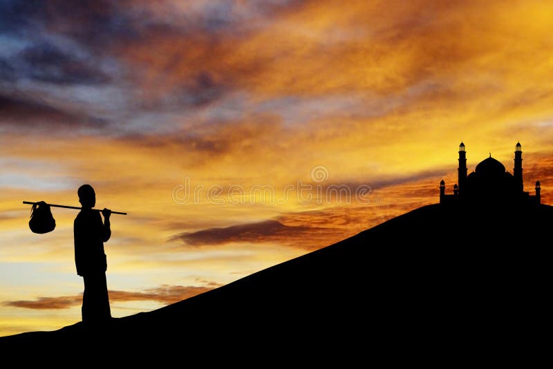 Silhouette of muslim wayfarer walking to the mosque on the hill. Shot during the month of ramadan. Silhouette of muslim wayfarer walking to the mosque on the hill. Shot during the month of ramadan