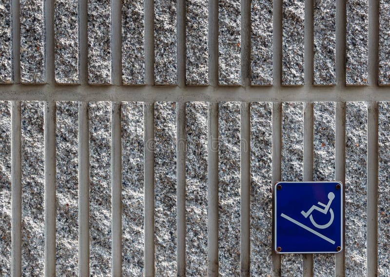 Ramp access sign on concrete wall background royalty free stock photo