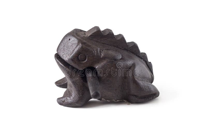 Singing frog rattle on isolated white background souvenir from Thailand, handmade. A symbol of wealth and prosperity. Singing frog rattle on isolated white background souvenir from Thailand, handmade. A symbol of wealth and prosperity