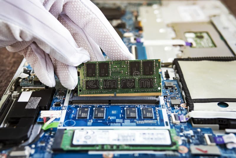 Random access memory for replacement to laptop computer. RAM module DDR in hand on the background of a modern notebook-transformer stock images