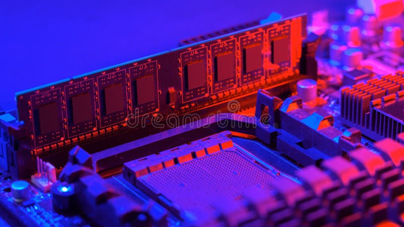 Random access memory. strip inserted into the motherboard. Motherboard out-of-the-box red-blue light. Computer components stock photography