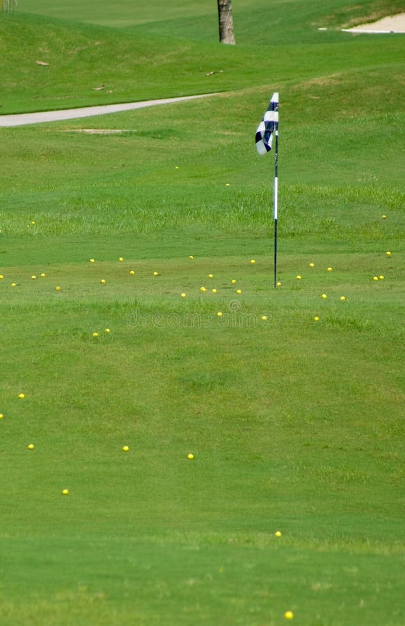 Many Yellow Golf Ball around Hole at Driving Range. Many Yellow Golf Ball around Hole at Driving Range