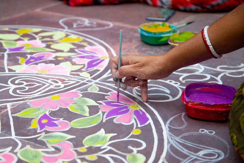 Rangoli- an Indian traditional power drawing. Indian traditional culture, art and religion. abstract mandala Oriental background, selective focus. Rangoli- an Indian traditional power drawing. Indian traditional culture, art and religion. abstract mandala Oriental background, selective focus