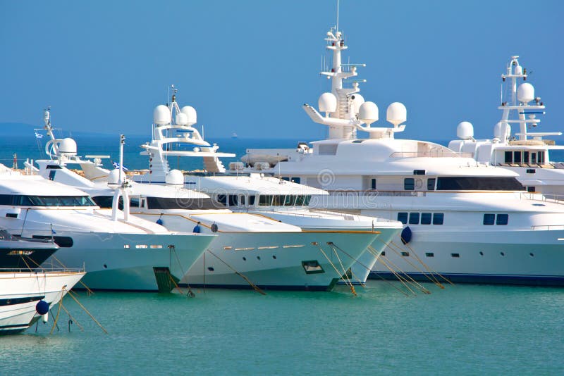 View of a luxury yachts bows at a marina. View of a luxury yachts bows at a marina.