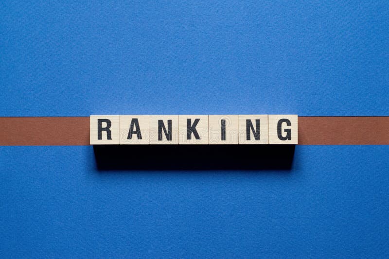 Ranking Word Made of Square Letter Word on Wooden Background Stock