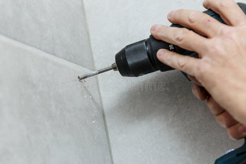 Rapairman Drilling Ceramic Tile on a Wall Stock Photo Image of