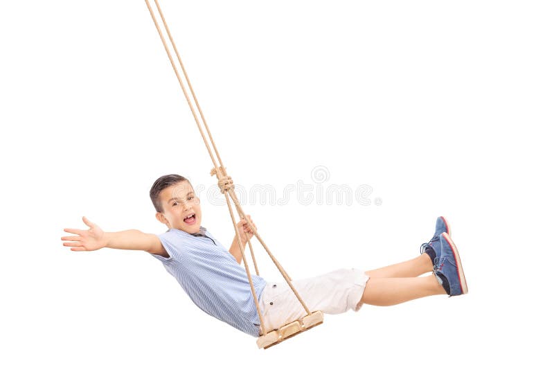 Rapaz pequeno alegre que balança em um balanço fotografia de stock Rapaz pequeno alegre que balança em um balanço fotografia de stock