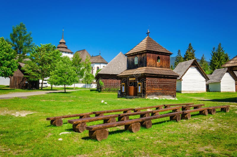 Rare wooden bell tower with folk houses Slovakia