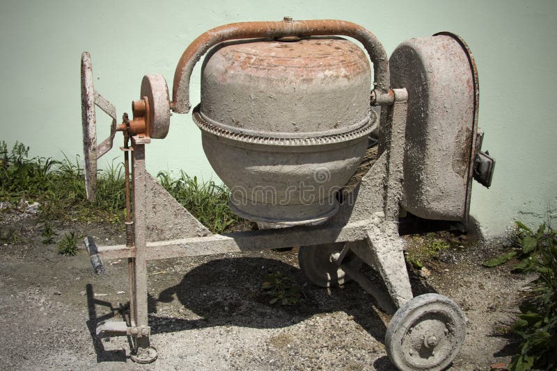Rarely Used Cement Mixer Standing Near a Wall. Cement Mixers, or Concrete  Mixers, Allow Users To Mix Large Amount of Cement, Sand, Stock Photo -  Image of metal, rotate: 118621802