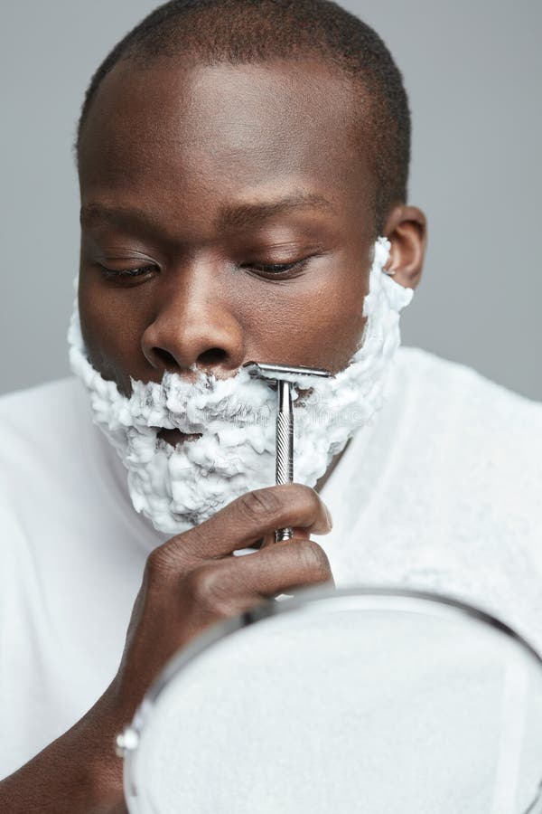 Male Shaving. Face Skincare Beauty Concept. Man Removes Facial Hair. Using Of Razor Shaver For Beard With Cream. Male Shaving. Face Skincare Beauty Concept. Man Removes Facial Hair. Using Of Razor Shaver For Beard With Cream