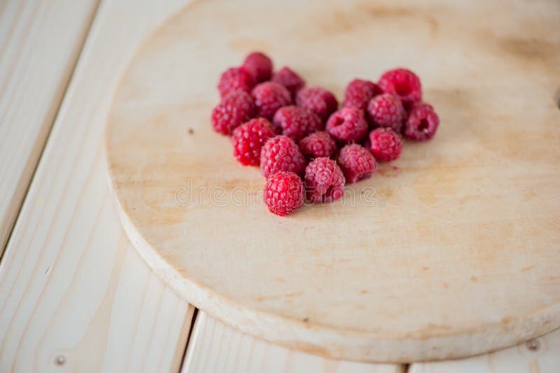 Raspberries in a heart stock photo. Image of cafe, aperitif 74756282