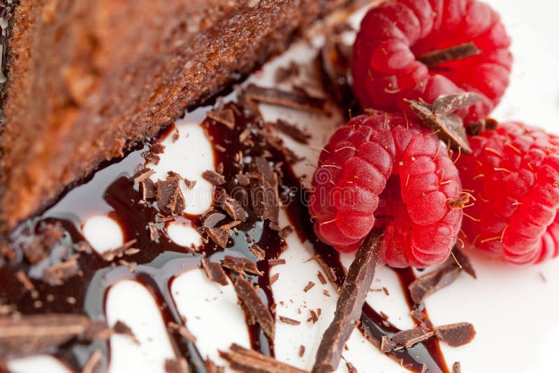 Raspberries and a slice of chocolate cake