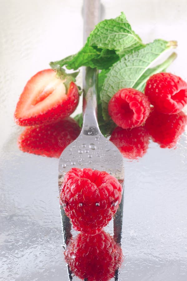 Raspberries & Strawberries stock image. Image of chilled 2362999