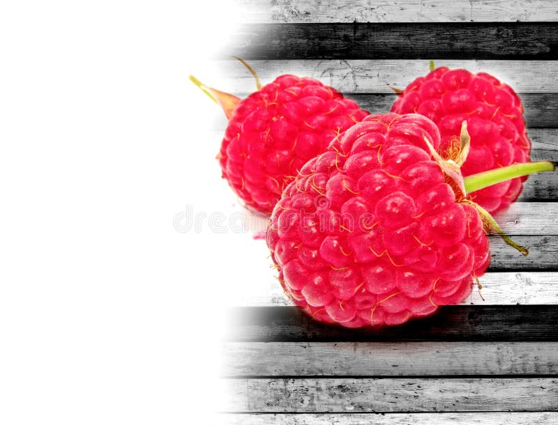 Raspberries on Wood Background