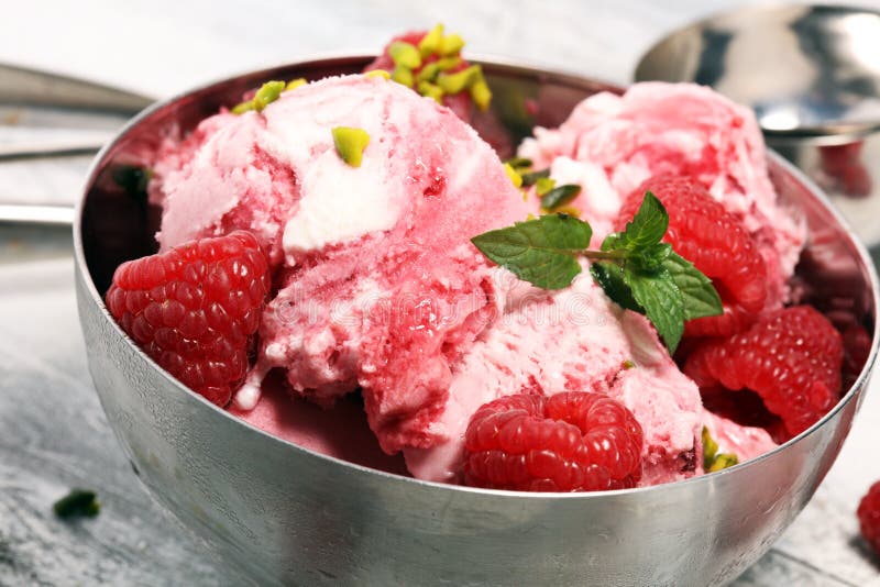 Raspberry Ice Cream Scoop with Chopped Nuts and White Chocolate Stock ...