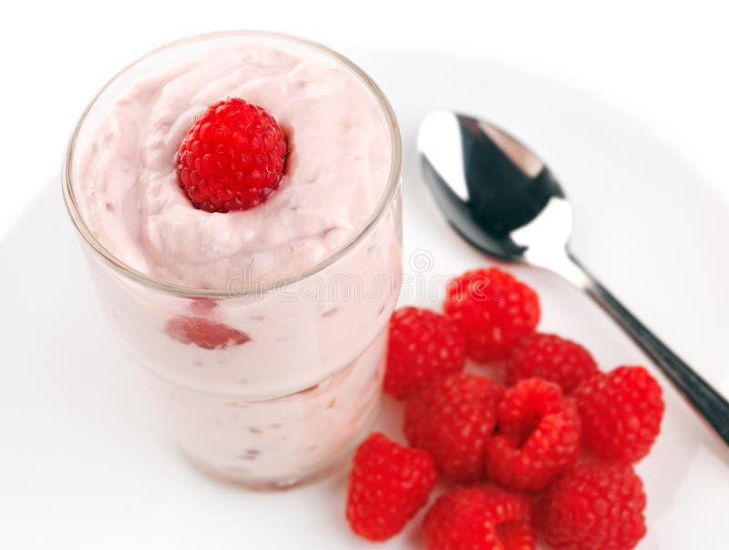 Raspberry yogurt with fresh raspberries stock photo