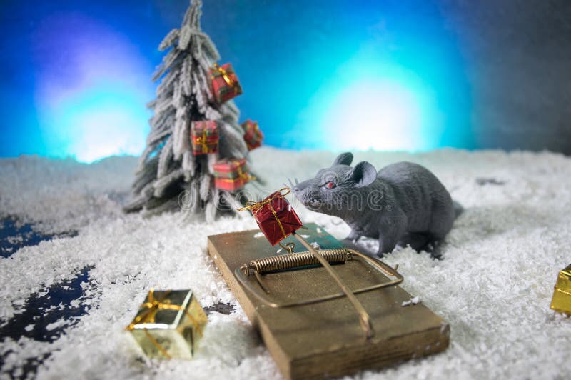The rat is a symbol Of the new year 2020. decorative cute brown rat around with a Christmas decor and Santa Claus royalty free stock photography The rat is a symbol Of the new year 2020. decorative cute brown rat around with a Christmas decor and Santa Claus royalty free stock photography