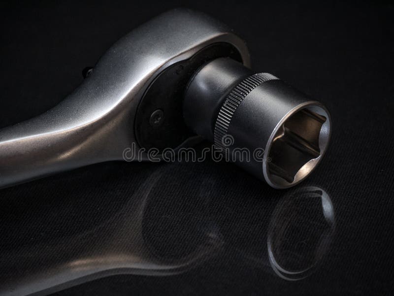 Ratchet Wrench on Black Background. Sockets for Socket Spanner Stock