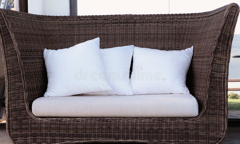 Rattan wicker sofa with pillows royalty free stock photos Rattan wicker sofa with pillows royalty free stock photos