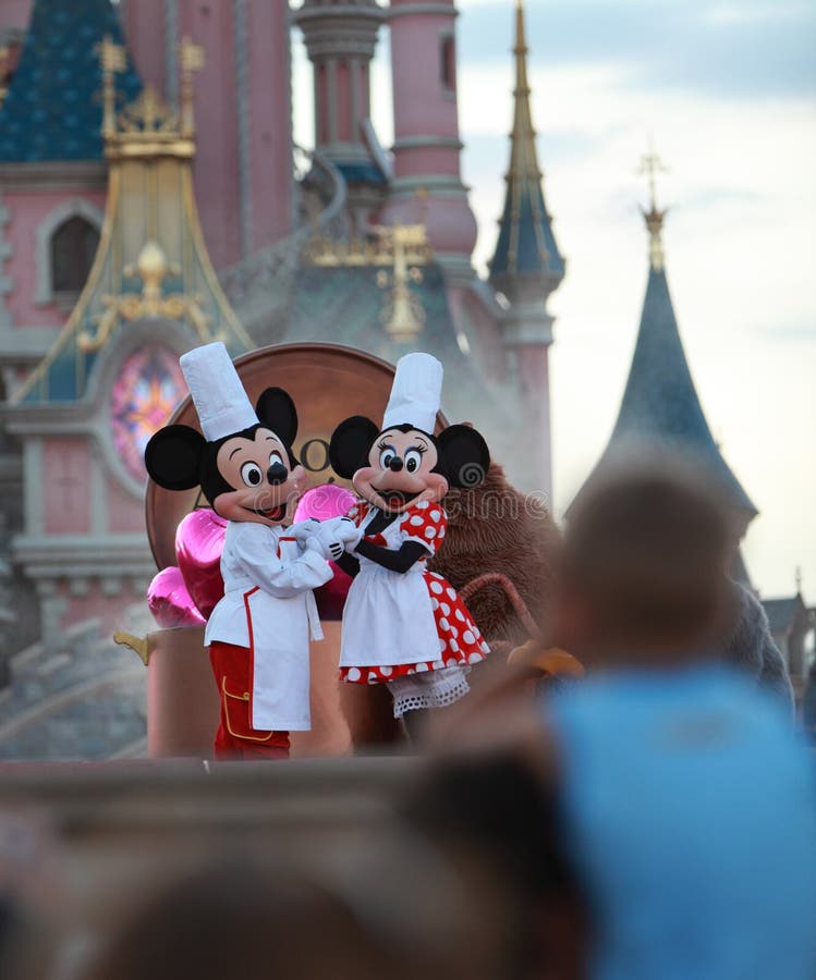 Disney characters (Mickey Mouse and Minnie Mouse) performing on a stage in front of the Princesse's Castle in Disneyland Paris. Disney characters (Mickey Mouse and Minnie Mouse) performing on a stage in front of the Princesse's Castle in Disneyland Paris.