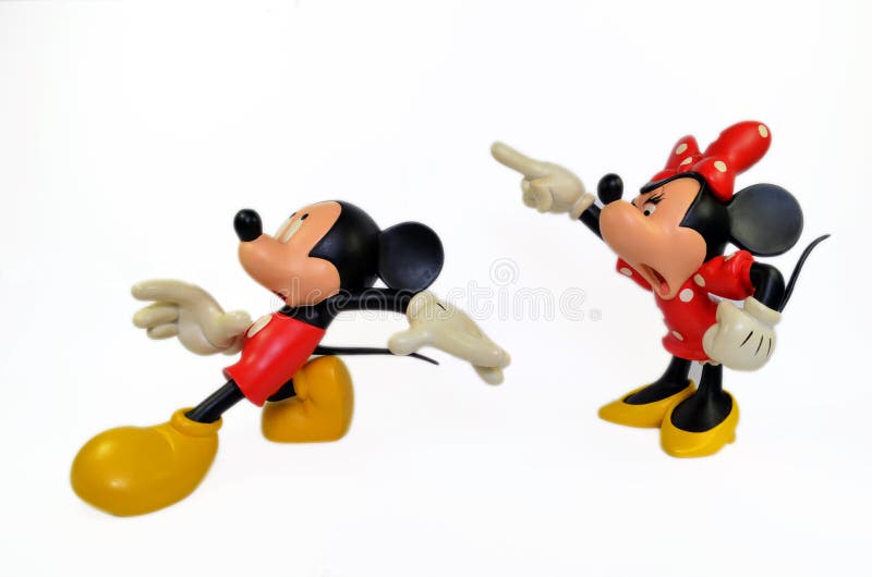 Minnie and Minnie Mouse Disney figures part of a huge private collection of big figs and original Disney store display figures. Mickey mouse is running away from an angry Minnie Mouse with a white isolated background. Minnie and Minnie Mouse Disney figures part of a huge private collection of big figs and original Disney store display figures. Mickey mouse is running away from an angry Minnie Mouse with a white isolated background
