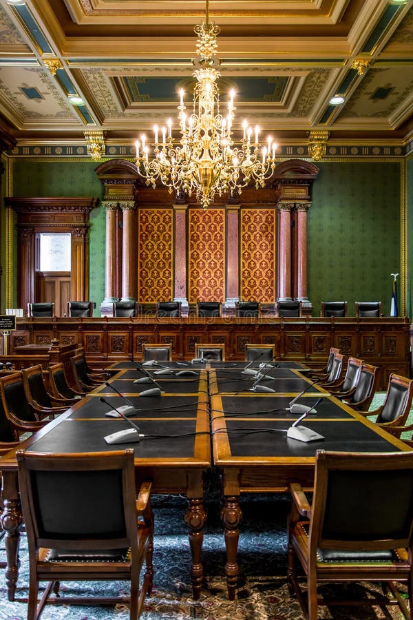 Inside the Des Moines Iowa State Capital building with ornate architecture, gold chandelier and painted ceilings. Inside the Des Moines Iowa State Capital building with ornate architecture, gold chandelier and painted ceilings.