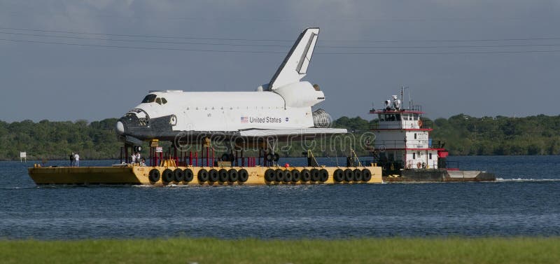 Space shuttle orbiter replica of Explorer travelling on barge through Port Canaveral heading to the Space Center in Houston, Texas, U.S.A. Space shuttle orbiter replica of Explorer travelling on barge through Port Canaveral heading to the Space Center in Houston, Texas, U.S.A.