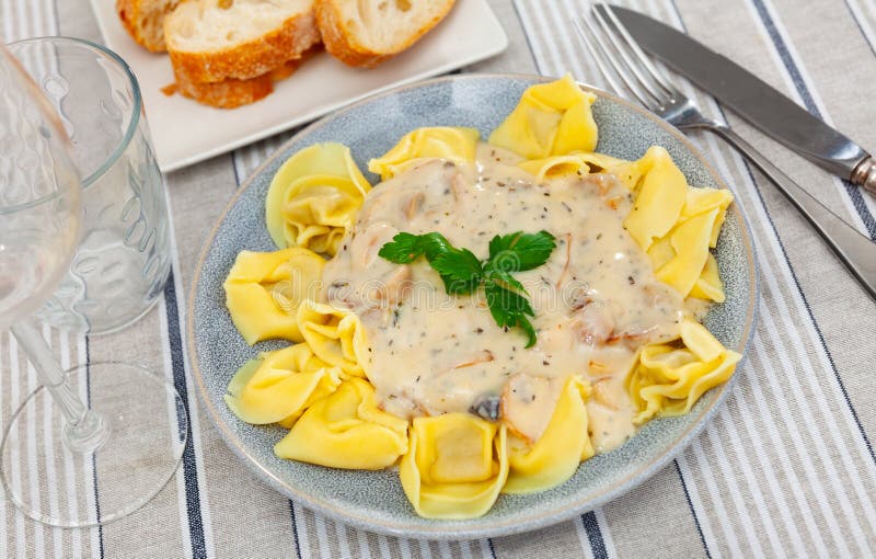 Ravioli with mushroom sauce served on platter royalty free stock photos