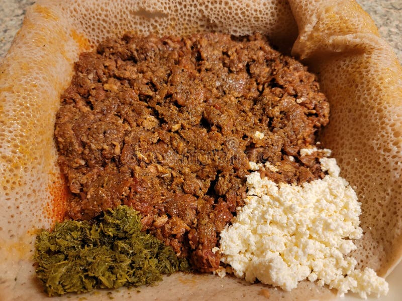 Raw Beef Ethiopian Food Called Kitfo with Bread and Greens and Cheese