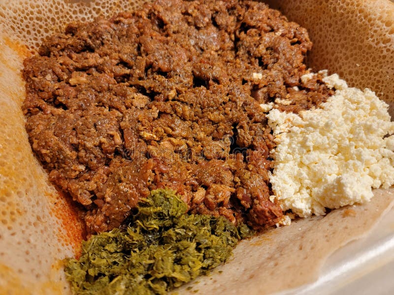 Raw Beef Ethiopian Food Called Kitfo with Bread and Greens and Cheese