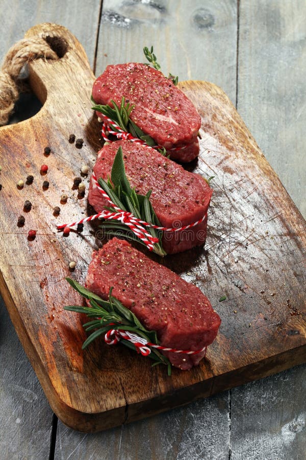 Raw Beef Fillet Steaks with Spices for Bbq Grilling. Stock Photo