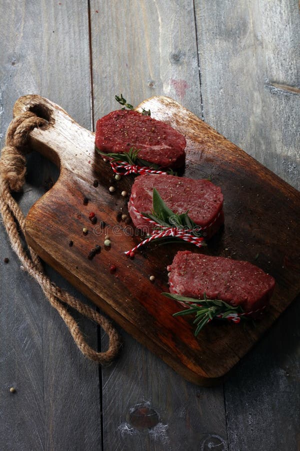 Raw Beef Fillet Steaks with Spices for Bbq Grilling. Stock Photo