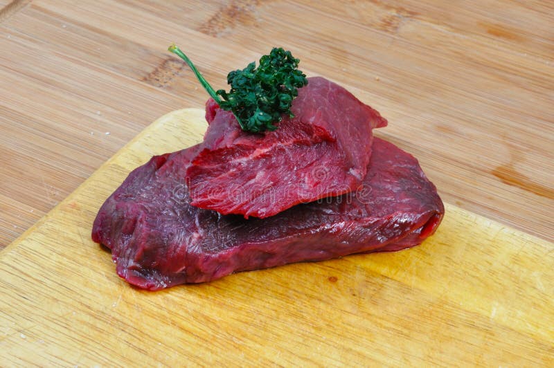 Raw beef meat on cutting board for barbecue