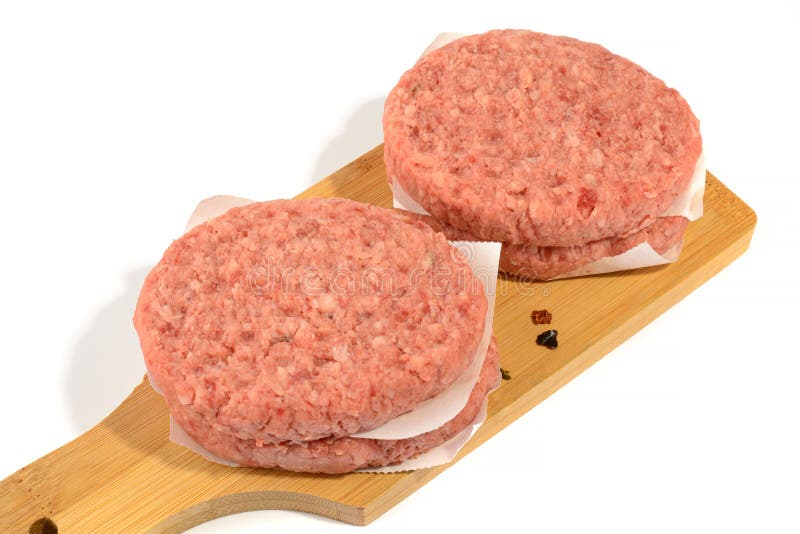 Raw Beef Patties for Making a Burger.Isolated on a White Background