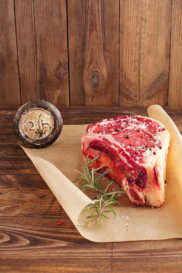 Raw Beef Rib Bone Steak on Wooden Board and Table Stock Photo Image of loin, tbone 35878248