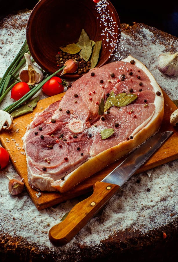 Raw beef steak with spices. On a rustic background. very high resolution image royalty free stock photography Raw beef steak with spices. On a rustic background. very high resolution image royalty free stock photography