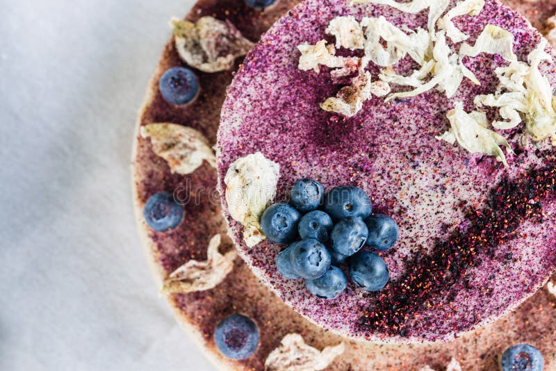 Raw blueberry cheesecake. Healthy handmade dessert. White background