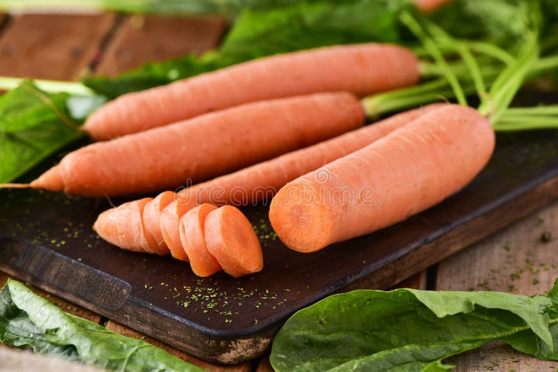 Raw carrots on a chopping board