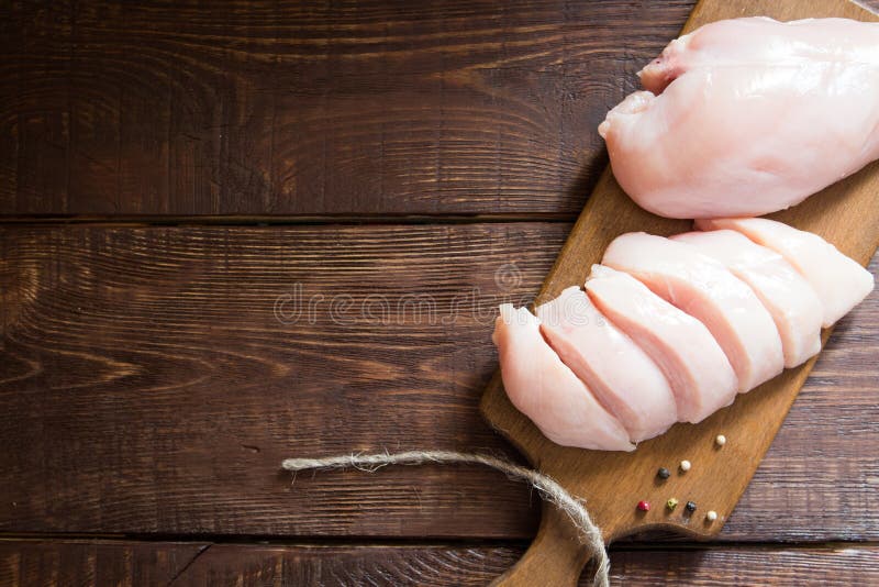 Raw Chicken Breast Fillets on Wooden Cutting Board. Stock Image Image