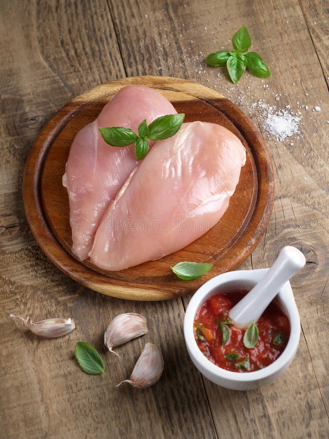 Raw chicken breast stock image. Image of tomato, sauce 52044065