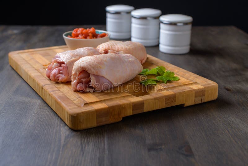 Raw chicken on a cutting board