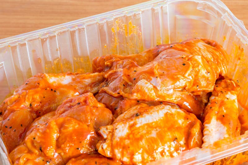 https://thumbs.dreamstime.com/b/raw-chicken-wings-mexican-sauce-plastic-pack-raw-chicken-wings-mexican-sauce-plastic-pack-247970705.jpg