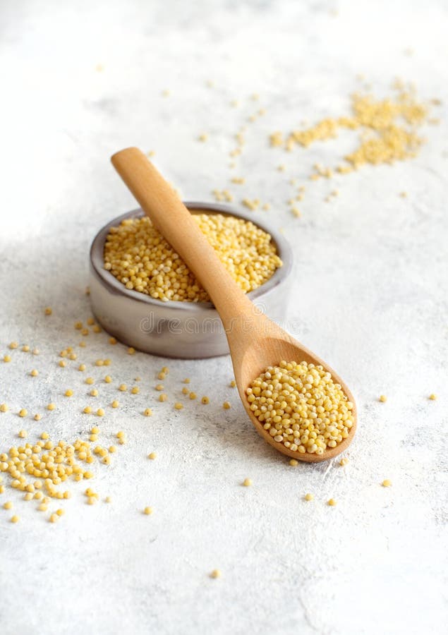 Raw Dry Hulled Millet in a Bowl with a Spoon Stock Photo Image of