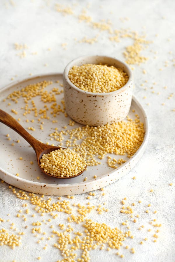 Raw Dry Hulled Millet in a Ceramic Bowl Stock Photo Image of space