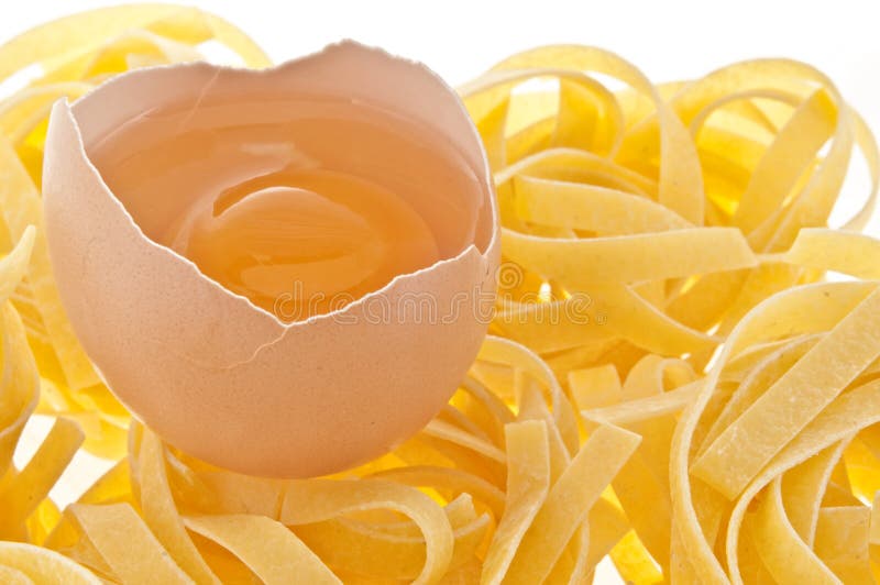 Raw egg and pasta. stock image. Image of protein, food 10737967
